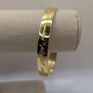 Kate Spade Gold Cuff Bracelet with Textured Finish and Engraving